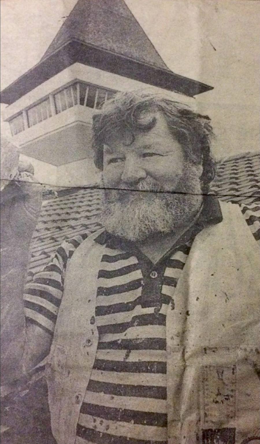 Herald Sun front page showing Katie’s grandfather, bearded and smiling in a paint-flecked cardigan, in front of Mitchelton’s famous tower in the early 2000s